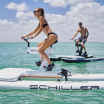 Sexy girl and athletic man while using schiller water bikes